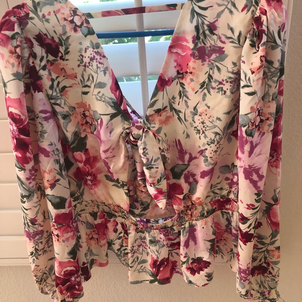 Express floral faux wrap tie back peplum top.